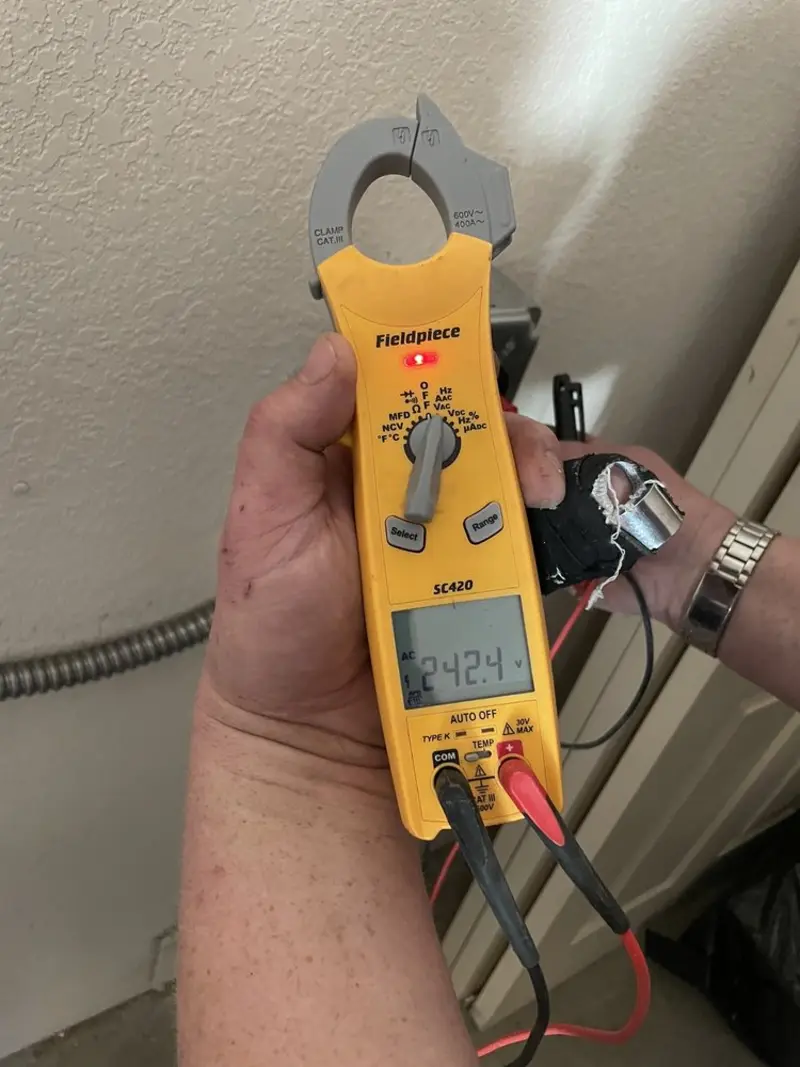 Voltage testing with clamp meter during Electrical Installation Services in Baxter Village